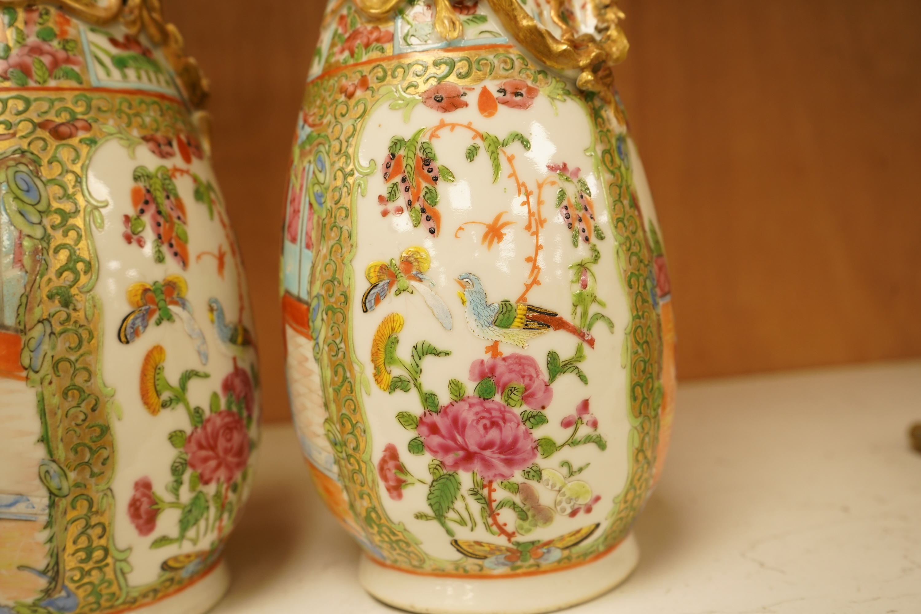A pair of 19th century Chinese famille rose vases, 25cm